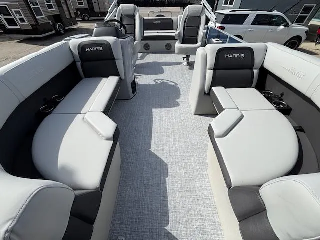 Slide: The Image of 2025 Harris Cruiser 210 SLDH pontoon boat interior with plush seating and modern design. - 23