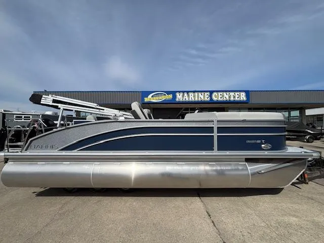 Slide: The Image of 2025 Harris Cruiser 210 SLDH pontoon boat at a marine center dealership. - 25