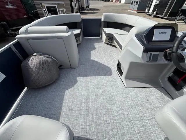 Slide: The Image of 2025 Harris Cruiser 210 SLDH pontoon boat interior with modern seating and steering console. - 7