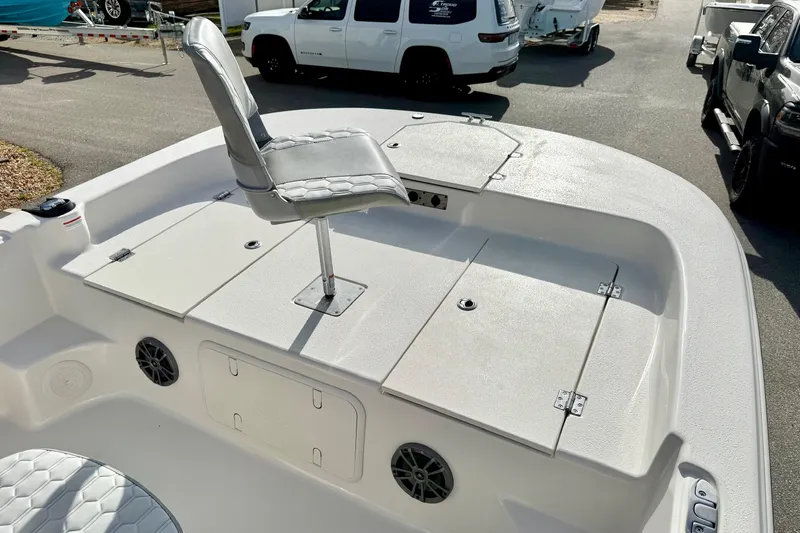 Slide: The Image of 2025 Carolina Skiff 19 LS boat deck with seating and storage compartments. - 11