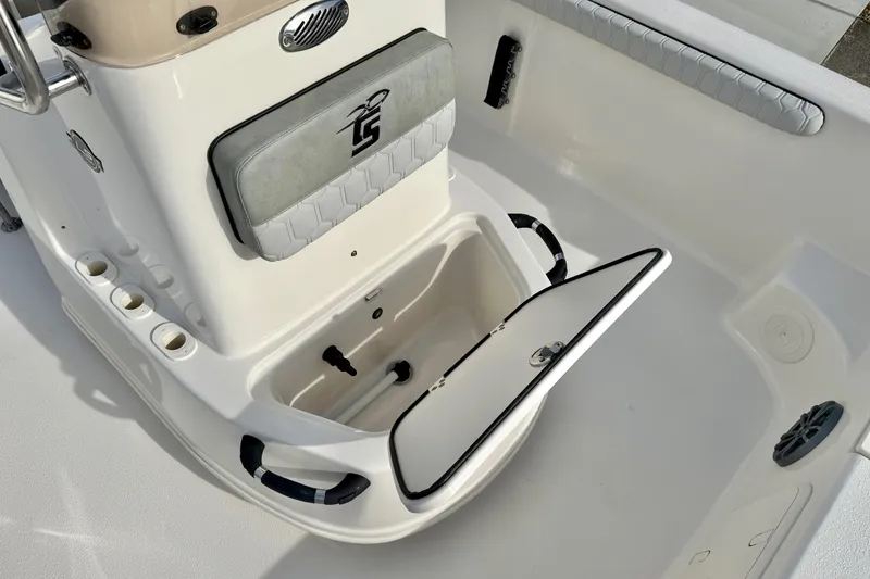 Slide: The Image of 2025 Carolina Skiff 19 LS boat interior with open storage compartment and seating. - 14