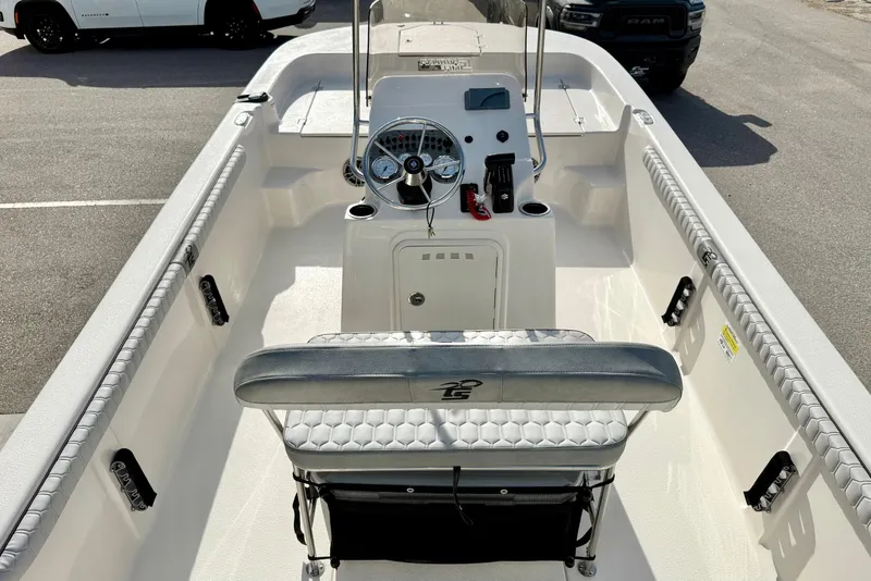 Slide: The Image of 2025 Carolina Skiff 19 LS boat interior with steering console and seating. - 16