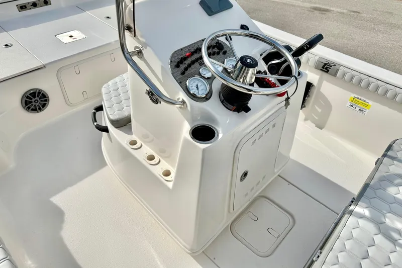 Slide: The Image of 2025 Carolina Skiff 19 LS boat console with steering wheel and gauges. - 18