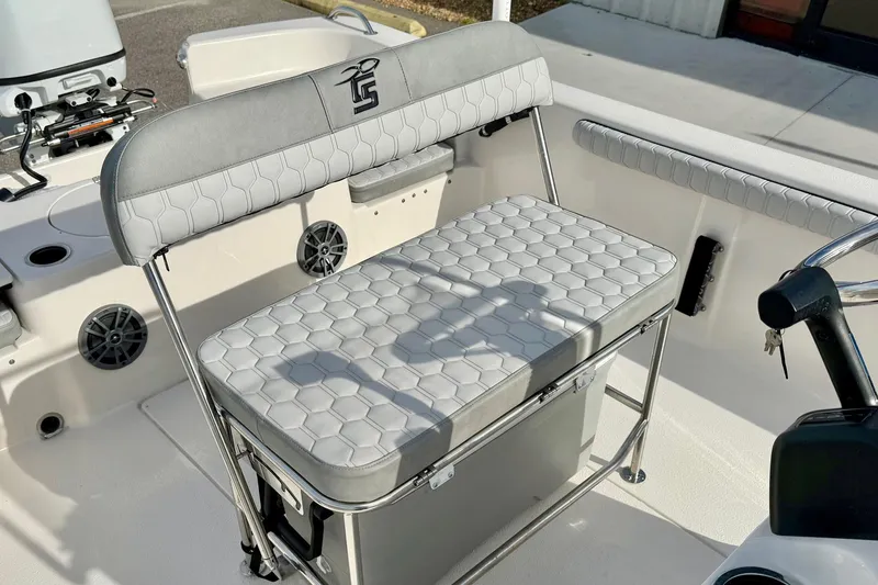 Slide: The Image of 2025 Carolina Skiff 19 LS boat interior with cushioned seating and storage. - 20