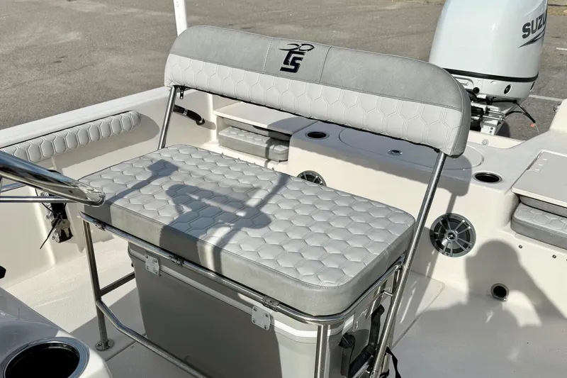 Slide: The Image of 2025 Carolina Skiff 19 LS boat interior with cushioned seating and storage. - 21