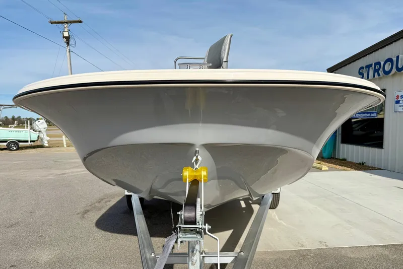 Slide: The Image of 2025 Carolina Skiff 19 LS boat on trailer, front view, outdoors. - 7