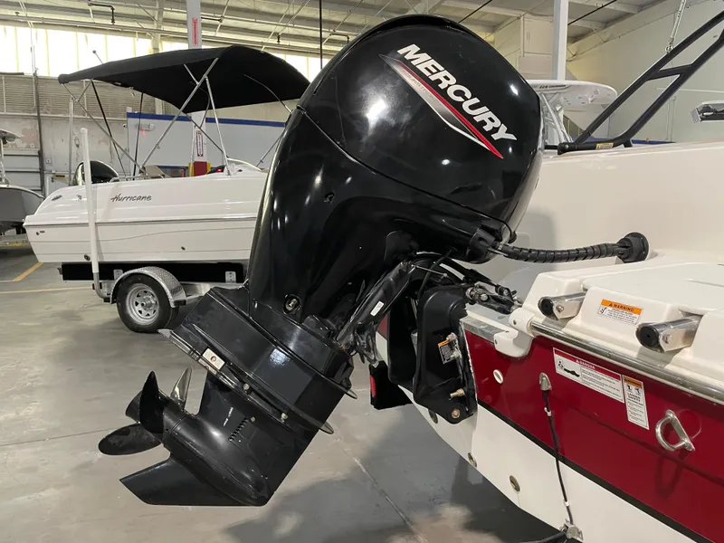 Slide: The Image of 2021 Hurricane SunDeck Sport 201 OB with Mercury outboard motor in showroom. - 12