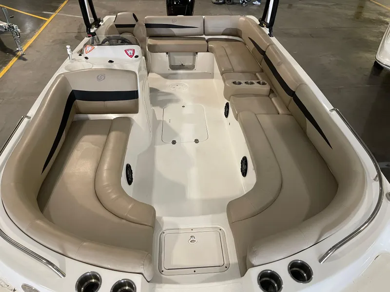 Slide: The Image of 2021 Hurricane SunDeck Sport 201 OB boat interior with spacious seating and cup holders. - 17