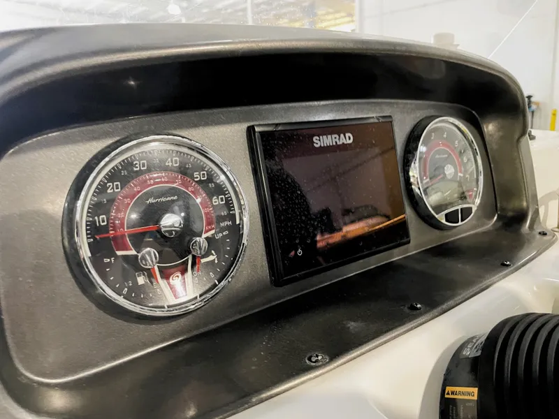 Slide: The Image of Dashboard of 2021 Hurricane SunDeck Sport 201 OB with Simrad display and gauges. - 25