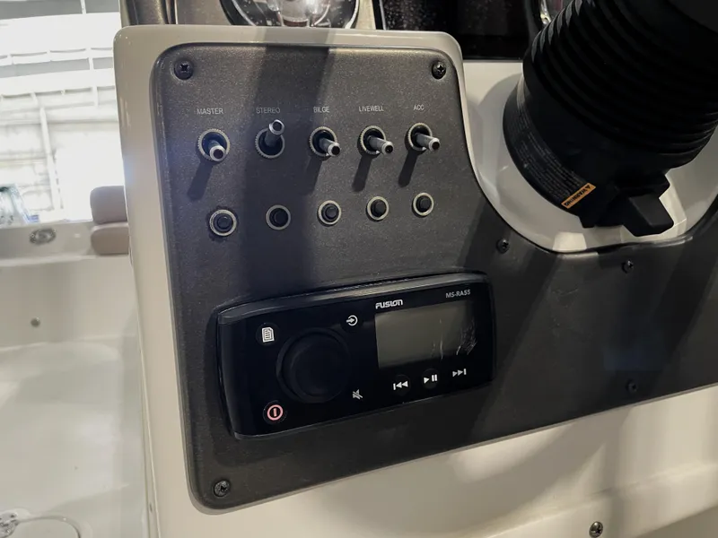 Slide: The Image of Control panel of 2021 Hurricane SunDeck Sport 201 OB boat with stereo system. - 26