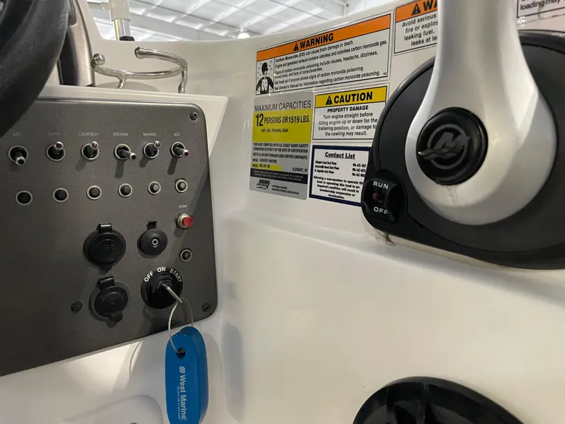 Slide: The Image of Control panel of 2021 Hurricane SunDeck Sport 201 OB boat with warning labels. - 27