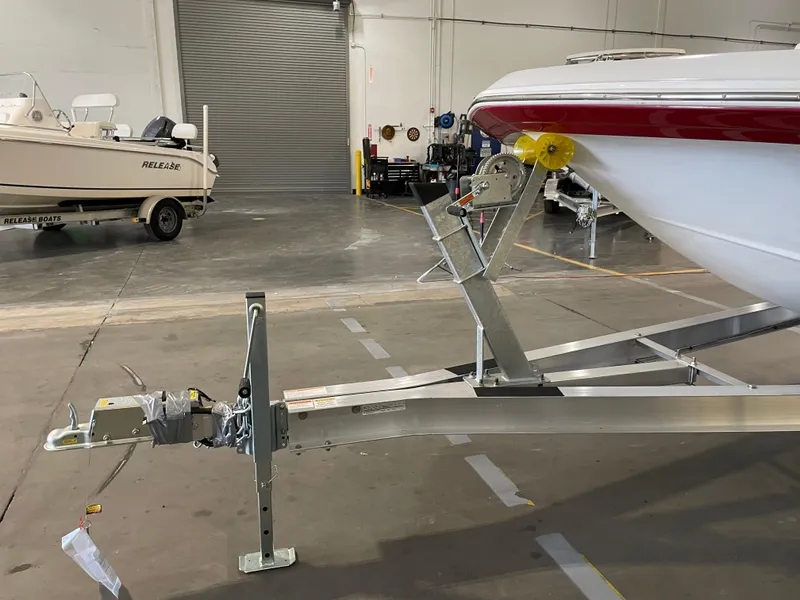 Slide: The Image of 2021 Hurricane SunDeck Sport 201 OB boat on trailer in indoor storage facility. - 30