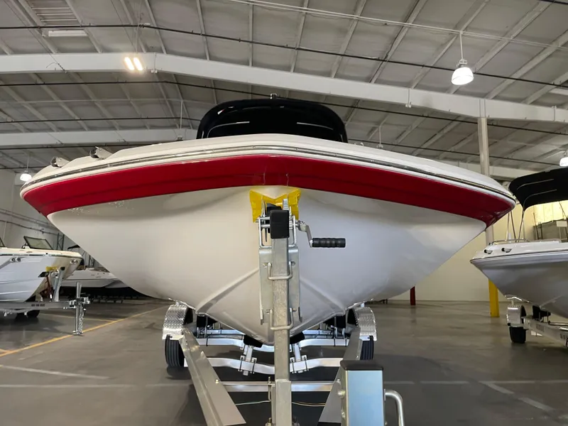 Slide: The Image of 2021 Hurricane SunDeck Sport 201 OB boat in indoor storage facility. - 6