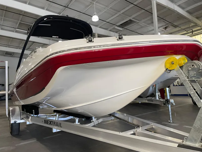 Slide: The Image of 2021 Hurricane SunDeck Sport 201 OB boat on trailer in showroom. - 7