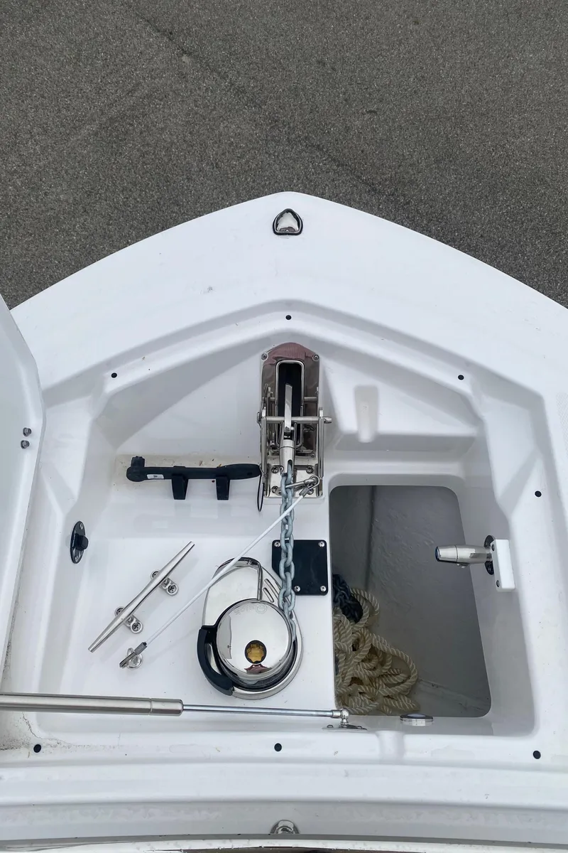 Slide: The Image of 2025 Blackfin 252 CC boat anchor compartment with chain and rope storage. - 16
