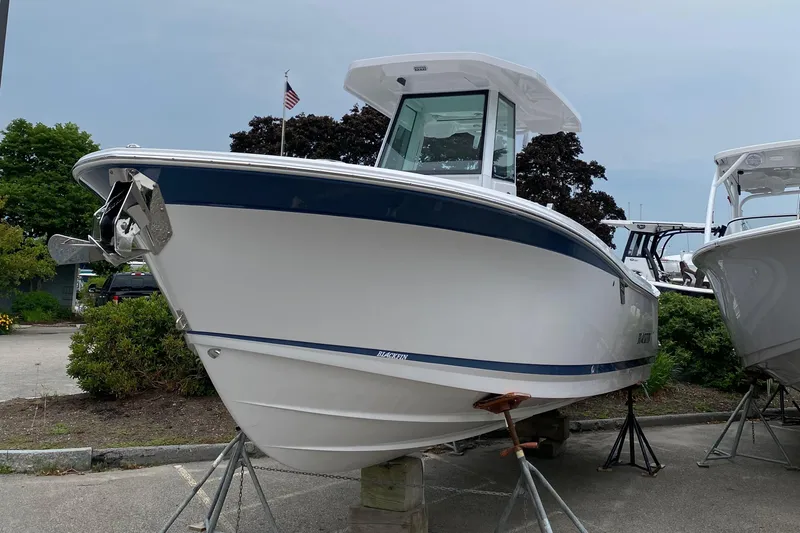 Slide: The Image of 2025 Blackfin 252 CC boat on display, featuring sleek design and modern features. - 3