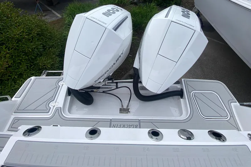 Slide: The Image of 2025 Blackfin 252 CC boat with dual Mercury outboard engines, viewed from above. - 4