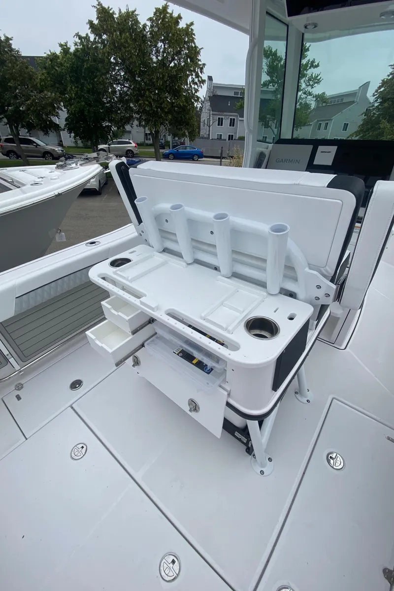 Slide: The Image of 2025 Blackfin 252 CC boat with fishing rod holders and storage compartments. - 7