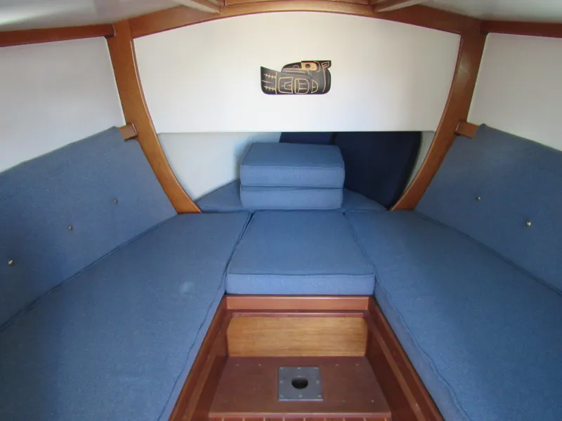 Slide: The Image of Interior of 1992 Devlin Surf Scoter boat with blue cushioned seating. - 11