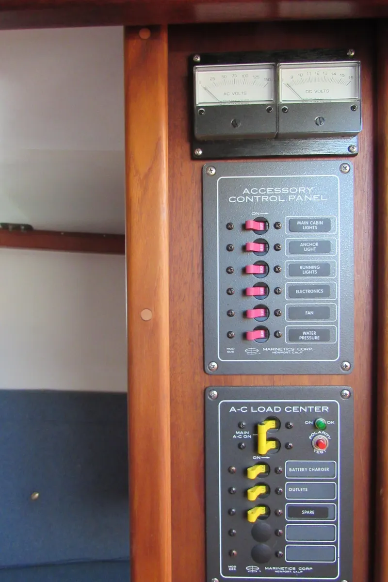 Slide: The Image of Control panel on 1992 Devlin Surf Scoter boat, featuring accessory and A-C load center. - 16