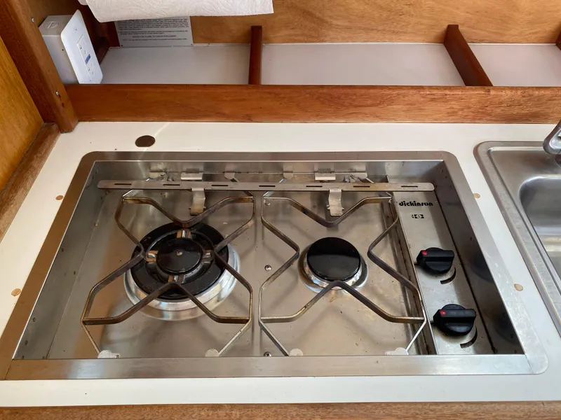 Slide: The Image of Two-burner stainless steel stove in a 1992 Devlin Surf Scoter boat kitchen. - 17