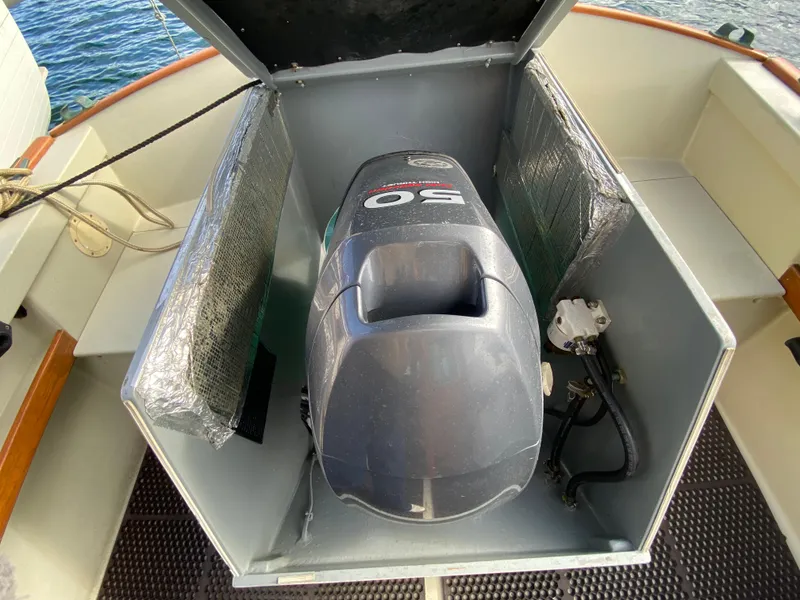 Slide: The Image of Engine compartment of a 1992 Devlin Surf Scoter boat with a 50 HP motor. - 23