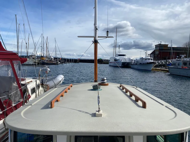 Slide: The Image of Devlin Surf Scoter 1992 boat docked in a marina with other vessels. - 7