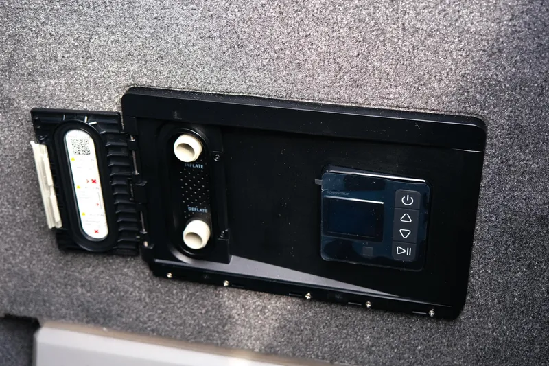 Slide: The Image of Control panel of a 2025 Supra SE450 boat, featuring digital display and connectors. - 12