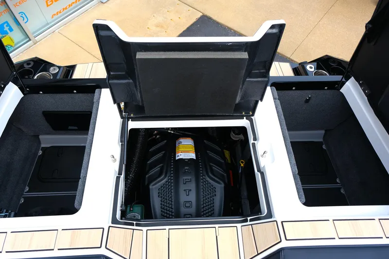 Slide: The Image of 2025 Supra SE450 engine compartment with open hatch, showcasing modern design and storage spaces. - 13