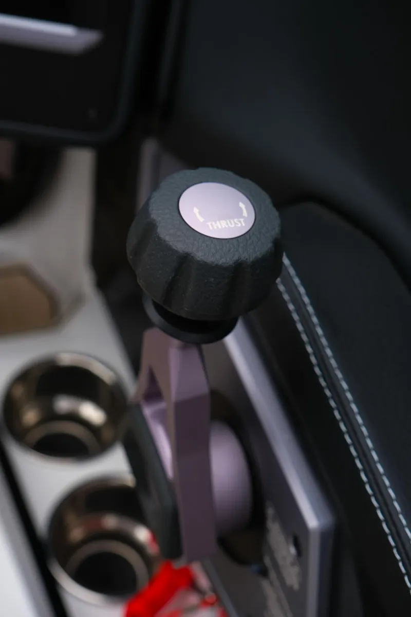 Slide: The Image of Close-up of 2025 Supra SE450 interior gear lever with cup holders. - 20