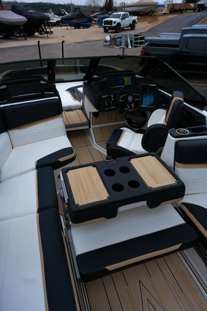 Slide: The Image of Luxurious interior of 2025 Supra SE450 boat with sleek seating and modern dashboard. - 29