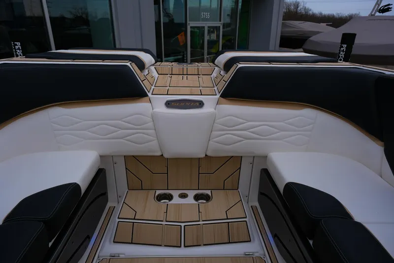 Slide: The Image of 2025 Supra SE450 boat interior with luxurious seating and wood accents. - 30