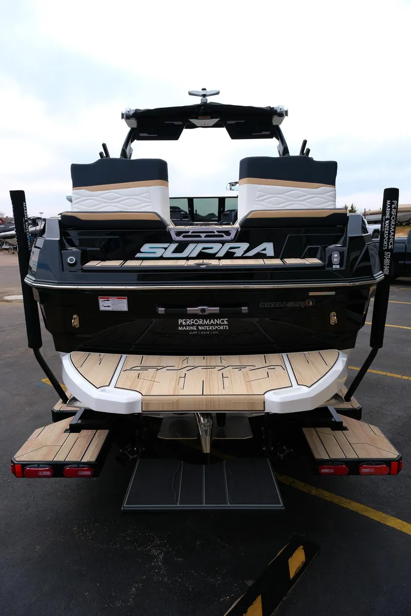 Slide: The Image of 2025 Supra SE450 boat, rear view, showcasing sleek design and spacious deck. - 6
