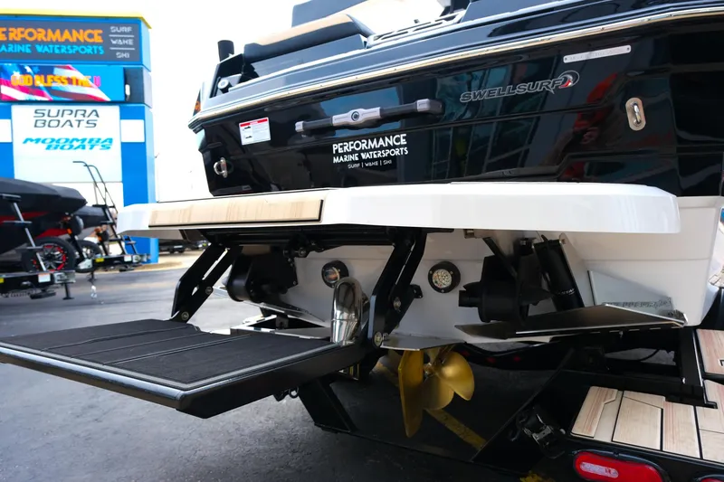 Slide: The Image of 2025 Supra SE450 boat rear view with performance marine features and SwellSurf technology. - 7