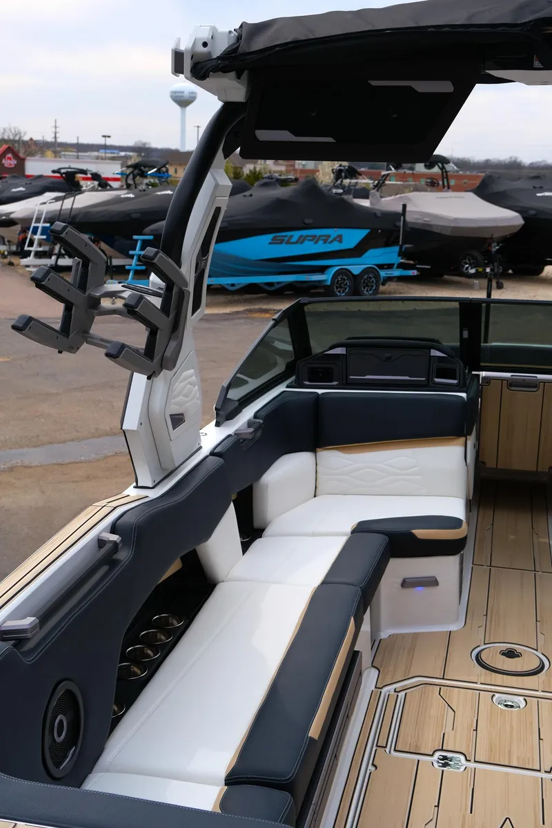 Slide: The Image of 2025 Supra SE450 boat interior with sleek seating and modern design elements. - 9