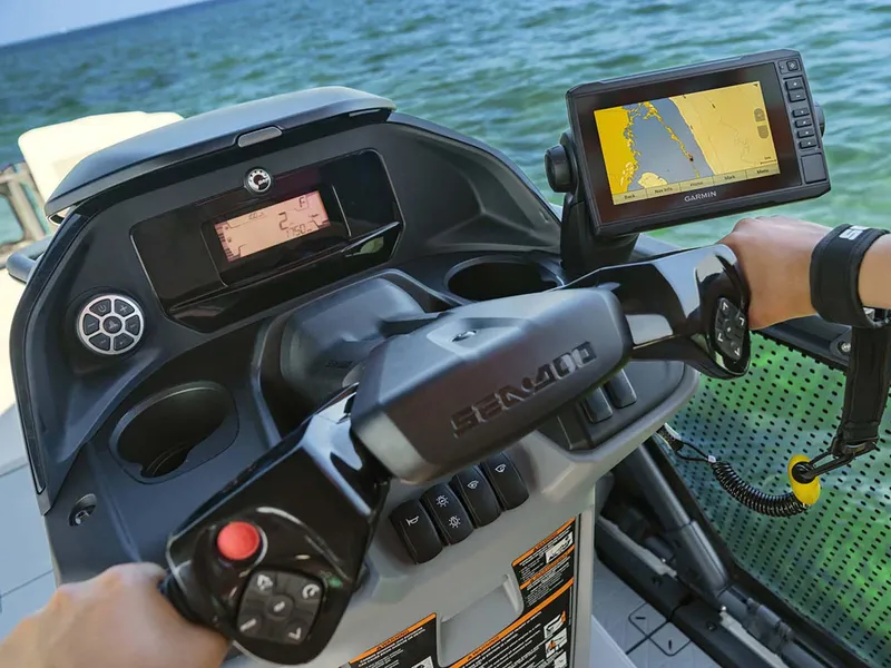 Slide: The Image of 2024 Sea-Doo Switch Cruise 21 dashboard with GPS navigation on open water. - 3