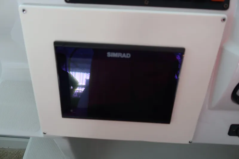 Slide: The Image of Simrad display on 2009 Crownline 340 CR boat dashboard. - 27