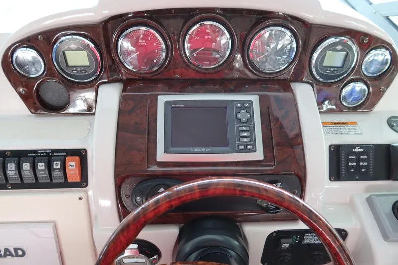 Slide: The Image of Dashboard of 2009 Crownline 340 CR boat with gauges and navigation system. - 28