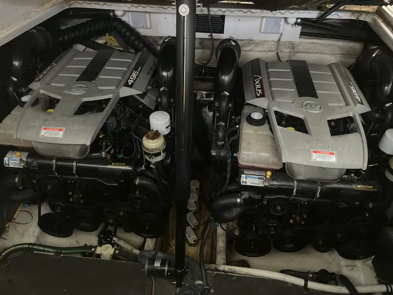 Slide: The Image of Twin engines in a 2009 Crownline 340 CR boat, showcasing powerful marine machinery. - 31