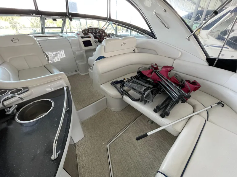 Slide: The Image of 2009 Crownline 340 CR boat interior with white seating and equipment on the deck. - 33