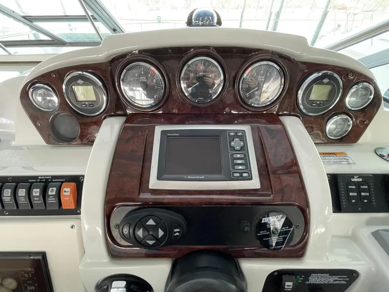 Slide: The Image of Dashboard of a 2009 Crownline 340 CR boat with gauges and controls. - 40