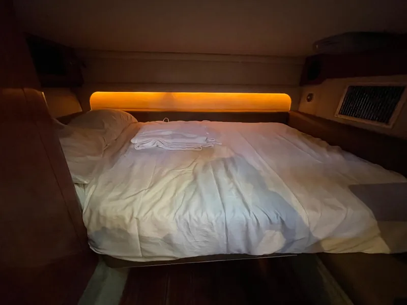 Slide: The Image of Cozy cabin bed in 2009 Crownline 340 CR yacht with ambient lighting. - 41