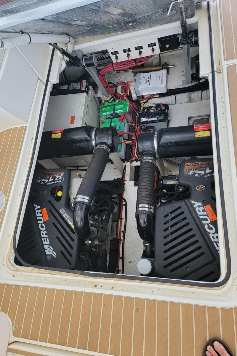 Slide: The Image of Engine compartment of a 2004 Cruisers Yachts 370 Express with Mercury engines. - 16