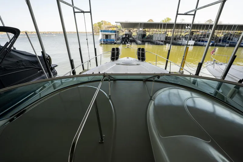 Slide: The Image of 2004 Cruisers Yachts 370 Express docked at marina, view from deck. - 43