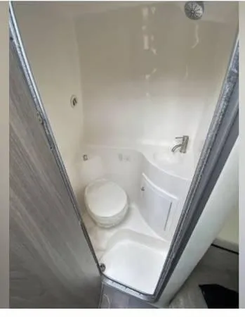 Slide: The Image of 2020 Regal 26 XO boat bathroom with compact toilet and sink. - 45