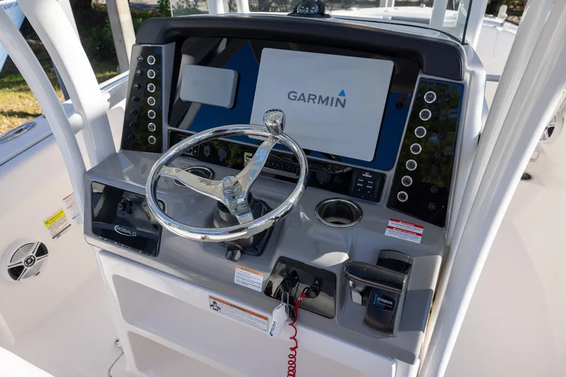 Slide: The Image of 2020 Robalo R230 Center Console boat dashboard with Garmin navigation system. - 9
