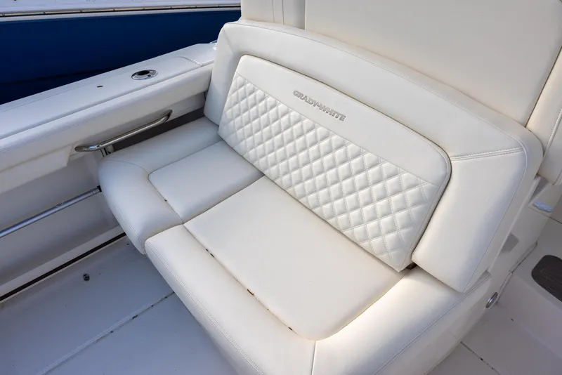Slide: The Image of 2024 Grady-White Freedom 375 boat seat with quilted white upholstery. - 10