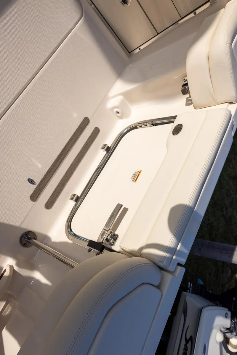 Slide: The Image of 2024 Grady-White Freedom 375 boat interior with storage compartment and seating. - 12