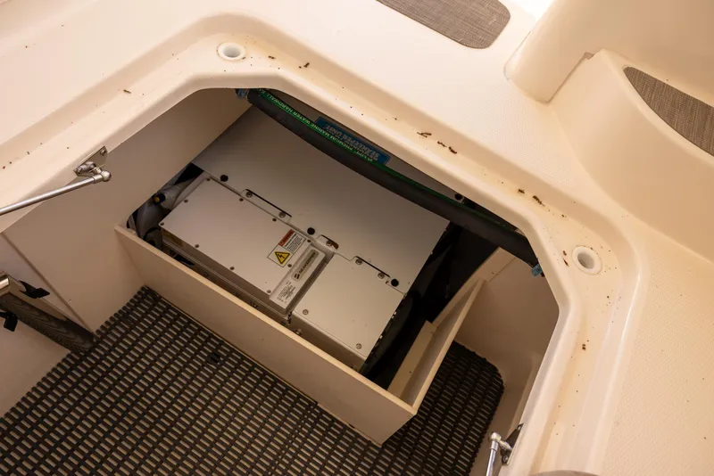 Slide: The Image of 2024 Grady-White Freedom 375 boat storage compartment with equipment inside. - 15