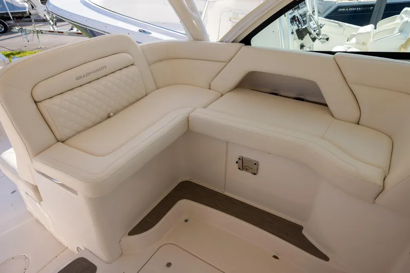 Slide: The Image of 2024 Grady-White Freedom 375 boat interior with luxurious beige seating. - 16